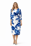 Woman wearing a blue floral dress on a white background