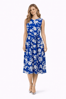 Woman wearing a blue floral dress on a white background