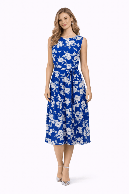 Woman wearing a blue floral dress on a white background