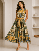 Woman wearing a patterned dress with a belt in a minimalistic room.