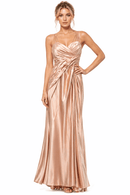 Woman wearing a rose gold evening gown on a white background